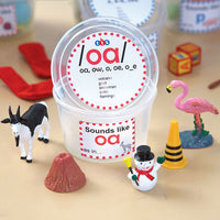 Close-up of assorted Phonics Tubs with visual items