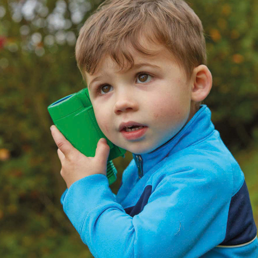 Child using See and Speak Recordable Binoculars 6-Pack in an outdoor setting