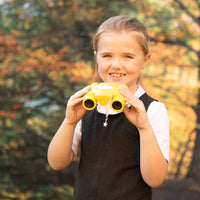 Child using See and Speak Recordable Binoculars 6-Pack in an outdoor setting