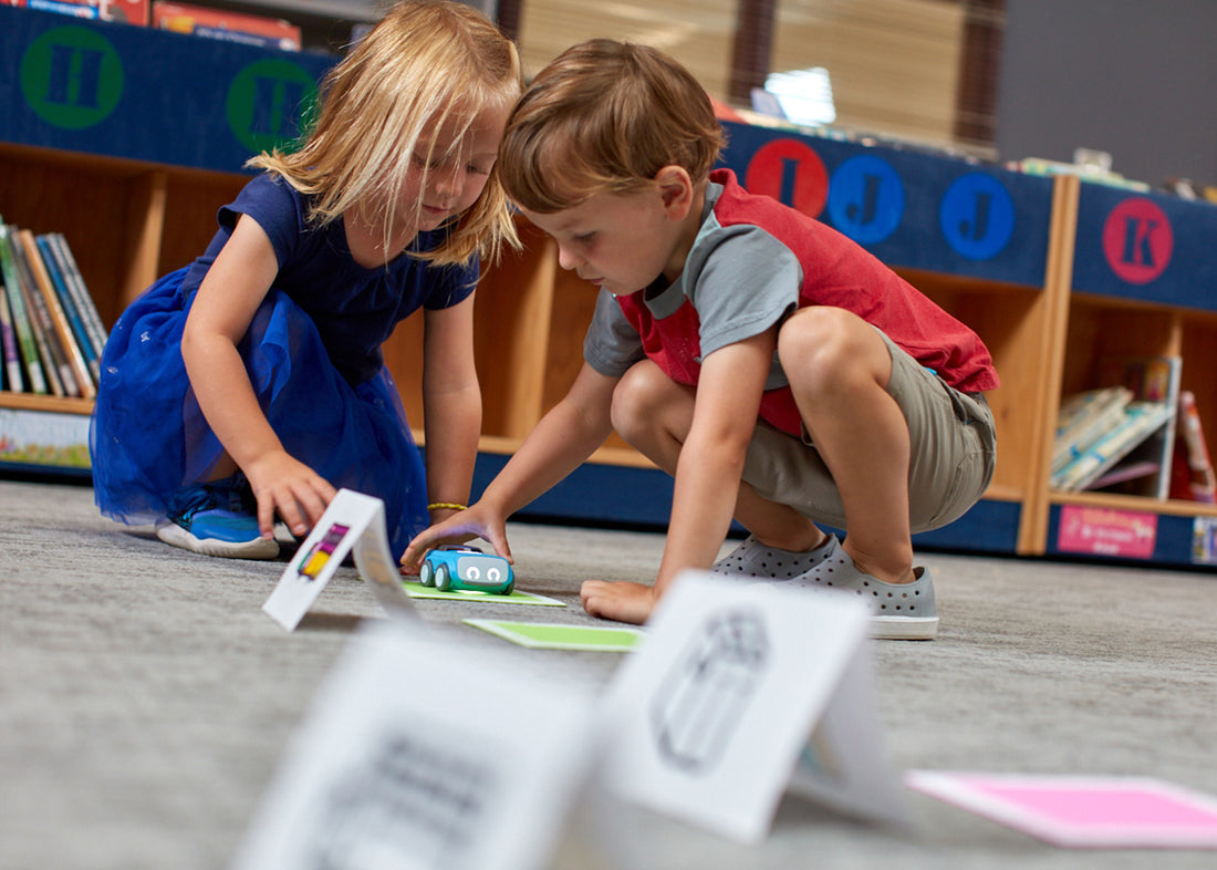 "Sphero indi robot on classroom floor ready for coding activity" - Showcases the indi robot in an educational setting.